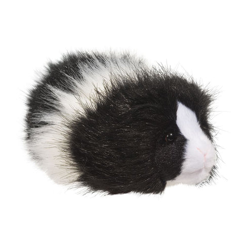 A plush black and white fuzzy guinea pig on a white background