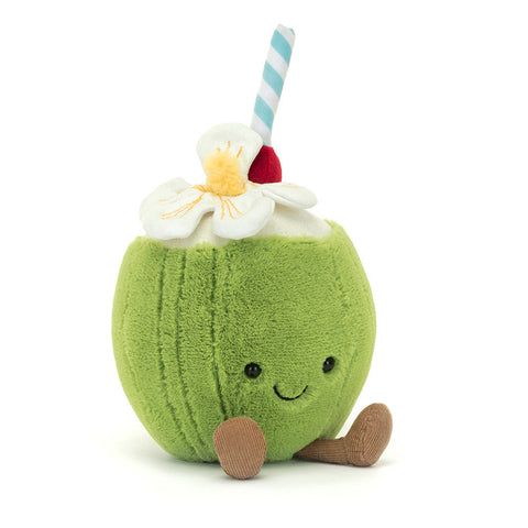 Image shows a stuffed green coconut with legs and a happy face. It has a straw and a flower sticking out from the top.