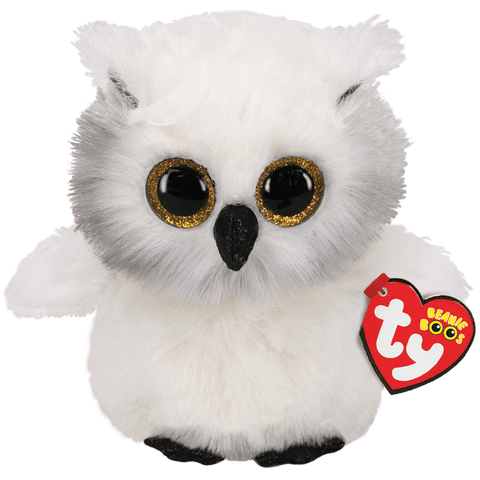 Image shows a white stuffed owl with large gold eyes