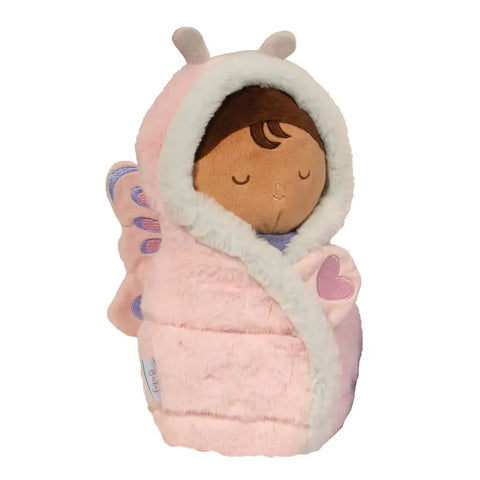 Image shows a stuffed doll swaddled in a pink and purple butterfly blanket.