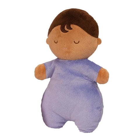 Image shows the stuffed doll. It has dark skin, dark brown hair, and is wearing a lavender-colored outfit.