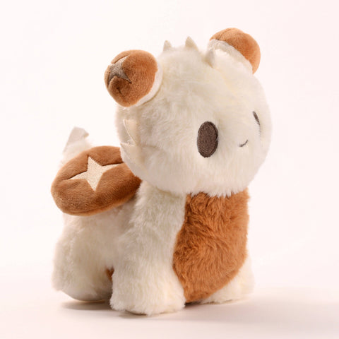 A cream and brown baby dragon plush. It is shiitake mushroom themed.