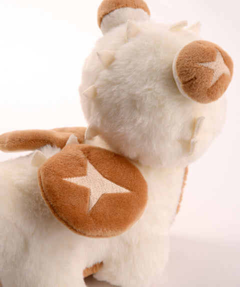 Back view of the plush shiitake mushroom baby dragon