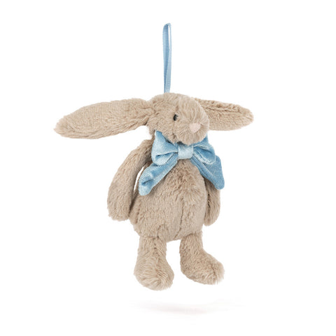 Plush bunny toy with a blue bow tie on a white background. It hangs from a blue ribbon.