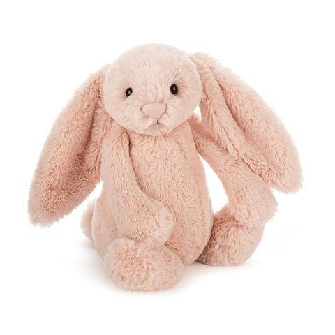 Plush bunny toy in light pink on a white background