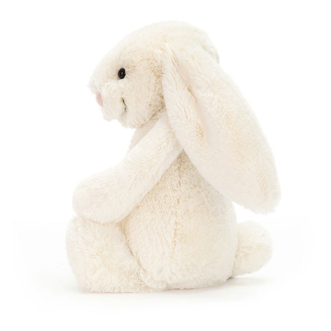 White plush bunny toy on a white background