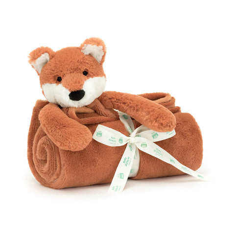 Plush fox toy with a blanket wrapped around it on a white background