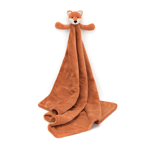 Orange plush blanket with a stuffed fox at the top