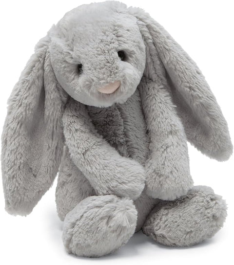Image shows a soft, stuffed grey bunny with long, floppy ears