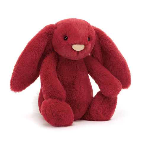 Red plush bunny toy on a white background