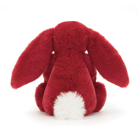 Back view of a Red plush bunny toy on a white background
