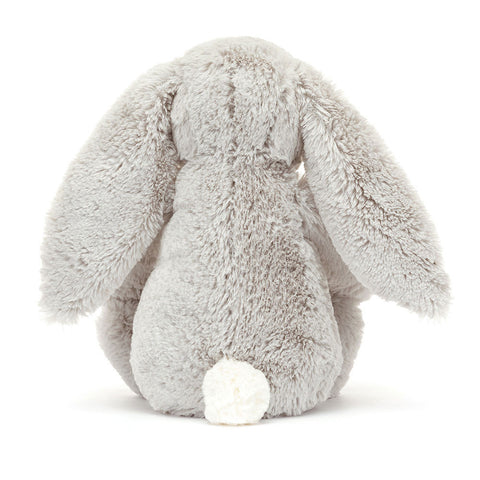 Back view of a silver Plush bunny toy on a white background