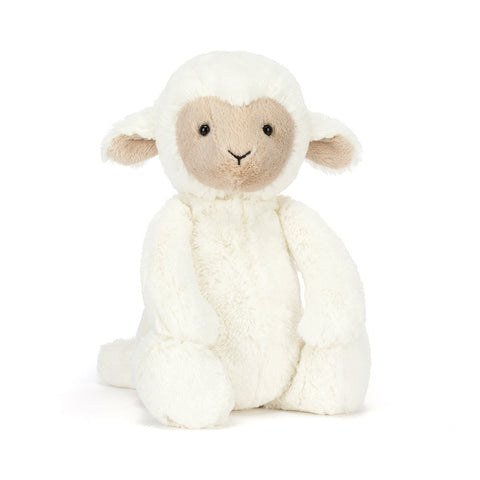 Stuffed toy lamb on a white background