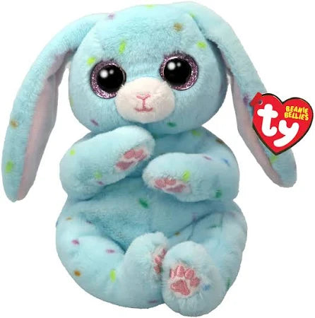 Image shows a pale blue stuffed bunny with pastel polka dots and large purple plastic eyes