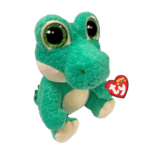 Image shows a seated stuffed crocodile with large green sparkly eyes