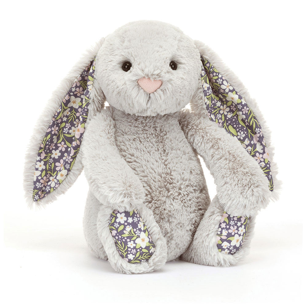 Image shows a siler stuffed bunny with floral fabric in its ears and on the bottom of its feet