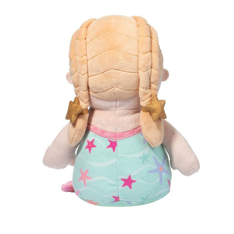 A back view of the plush blonde mermaid doll