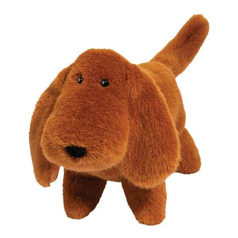 Image shows a standing brown stuffed Dachshund. It has a large round muzzle.