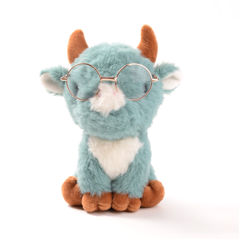 Light blue plush cow wearing gold wire rimmed glasses
