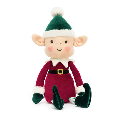 Plush toy elf with a green hat and red outfit on a white background