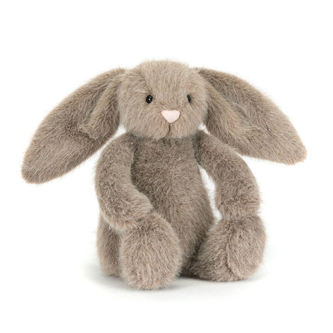 Plush light brown bunny toy with long ears on a white background