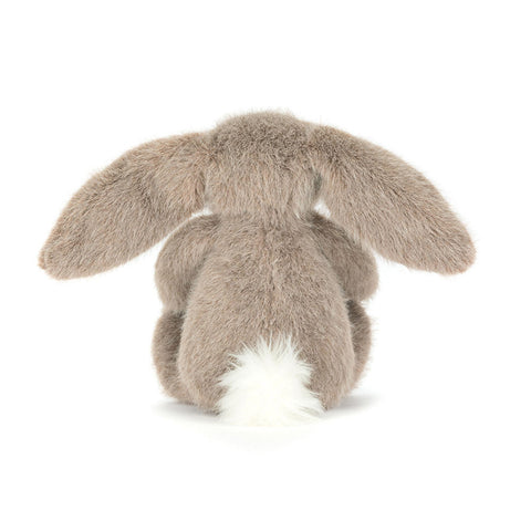 Back view of a light brown Plush bunny toy with long ears on a white background