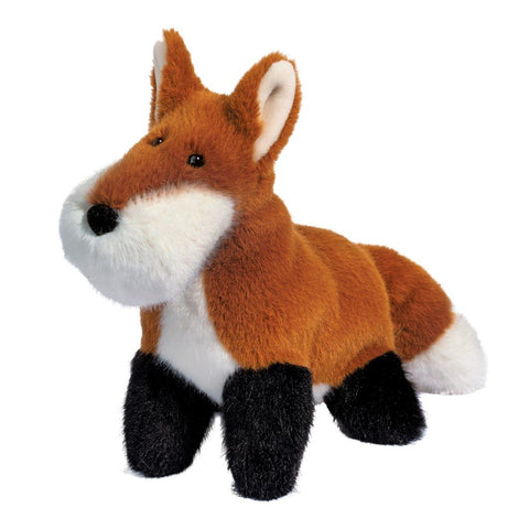 Image shows a standing stuffed fox. It has a large, round muzzle.