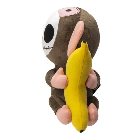 Image shows a side view of the stuffed monkey