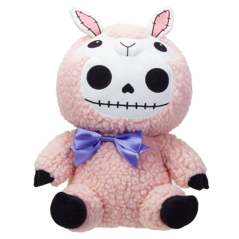Image shows a stuffed pink lamb with a bow on its neck. The lamb has a skeleton-type face.