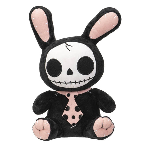 Image shows a black and pink stuffed bunny. It has a black and pink tie and a skeleton face. Parts of its body are stitched together.