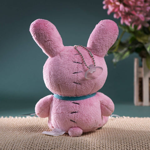 Image shows a back view of the pink horror bunny. A suction cup hanging from a chain is attached to its head.