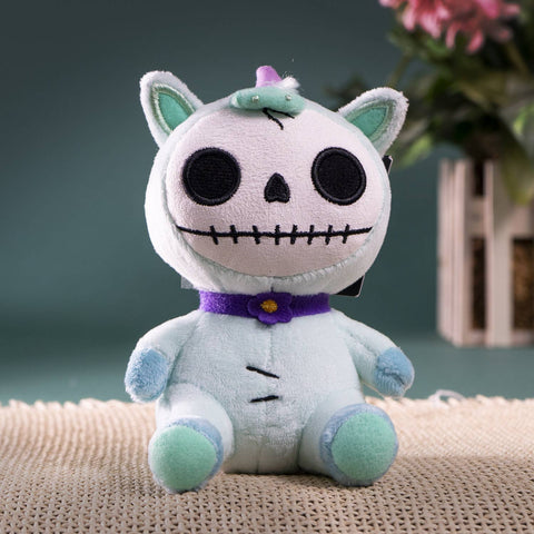 Image shows a light blue stuffed unicorn with various body parts stitched together. It has a skeleton-like face.