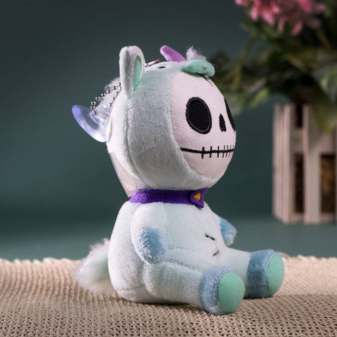 Image shows a side view of the stuffed unicorn
