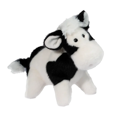 A plush black & white cow on a white background