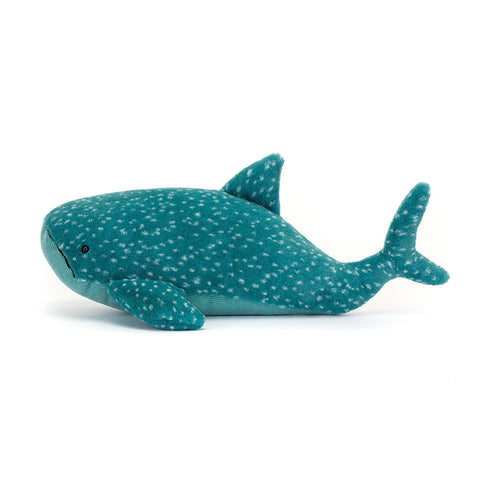 Side view of the teal plush whale shark on a white background