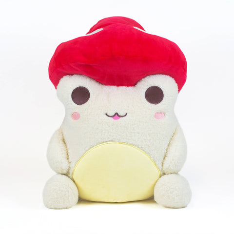Image shows a white stuffed frog wearing a redcap mushroom hat