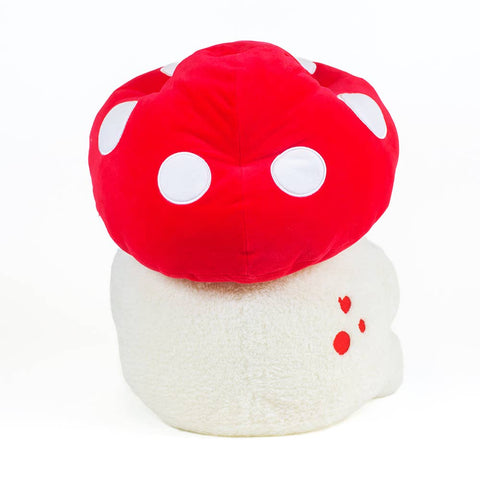 Image shows a back view of the stuffed frog wearing a mushroom hat