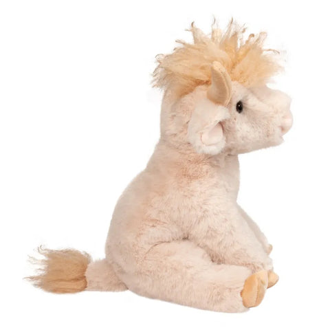 A side view of the plush Highland Cow