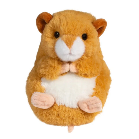 A plush toy depicting a baby hamster with a golden colored coat, white markings, pink paws, and a stitched smile.