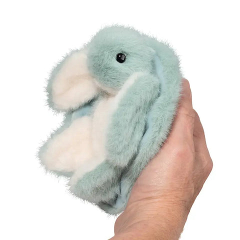 Image shows an adult holding the stuffed turtle. The shell fits in his hand.