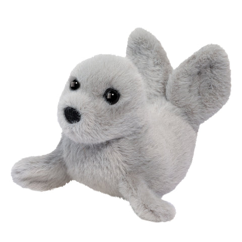A small, plush grey seal on a white background