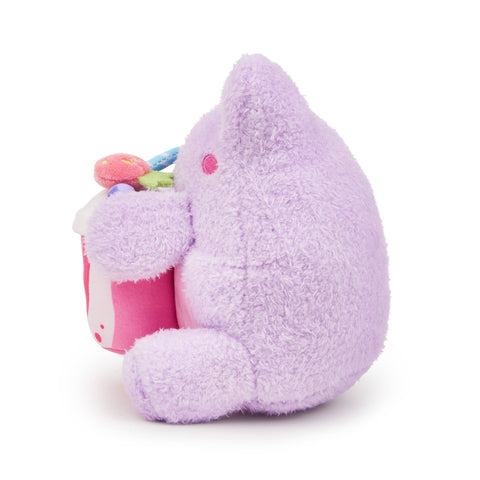 Purple plush frog holding a berry smoothie
