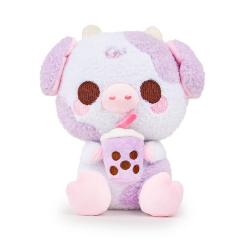 Plush purple cow holding a purple boba drink on a white background