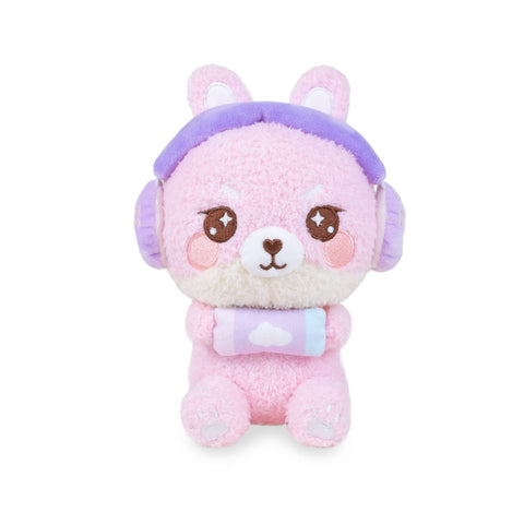 Pink plush bunny toy wearing purple headphones and holding a gaming console