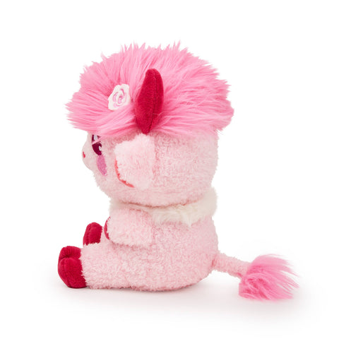 Side view of a plush pink highland cow