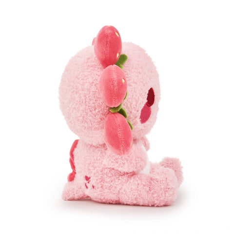Side view of a pink plush strawberry-themed axolotl