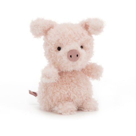 Image shows a fuzzy stuffed pig. It is sitting up on its rear end.