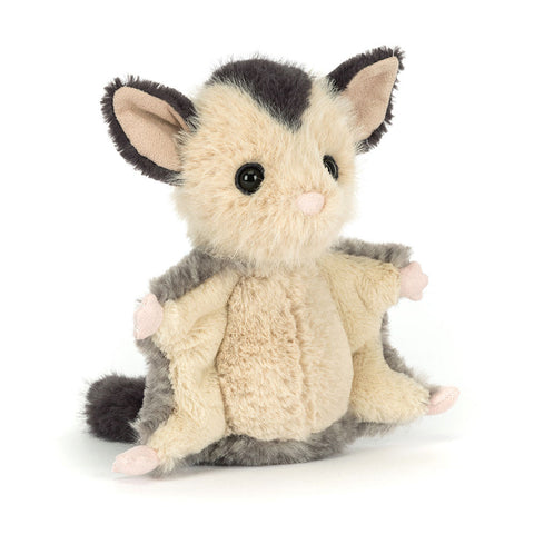 Image shows a stuffed Sugar Glider. Her arms are open revealing her wings.