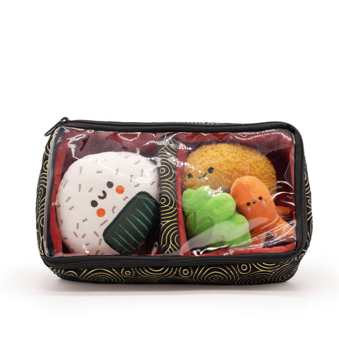 Image shows the four pieces of sushi zipped into the stuffed bento box