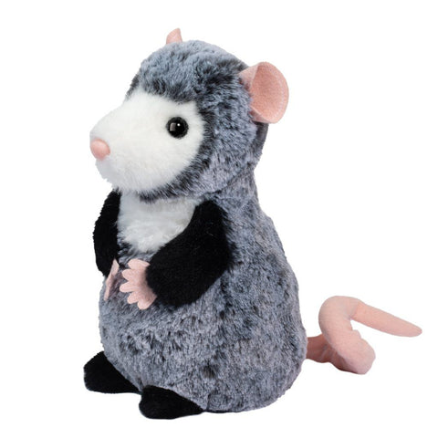 A plush grey opossum with a curly tail sits on her haunches on a white background